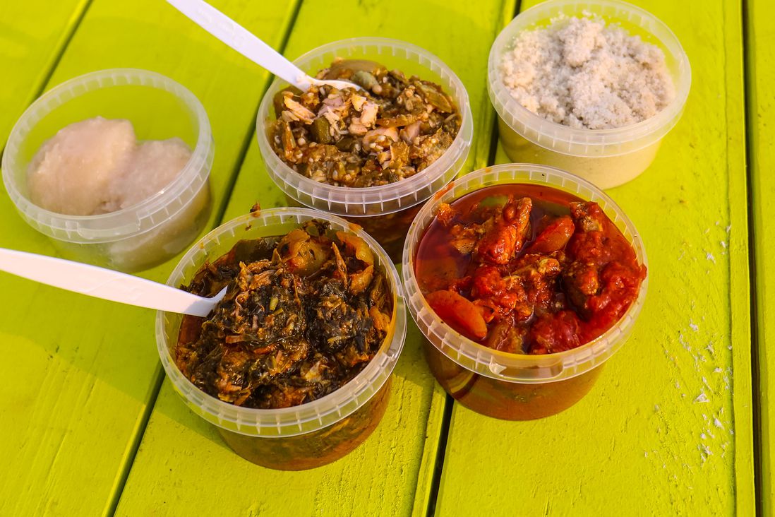 Top: Garri, Okra and Spinach with Salmon, Fonio; Bottom: Edikang Ikong Soup with Beef, West African Red Stew with Chicken